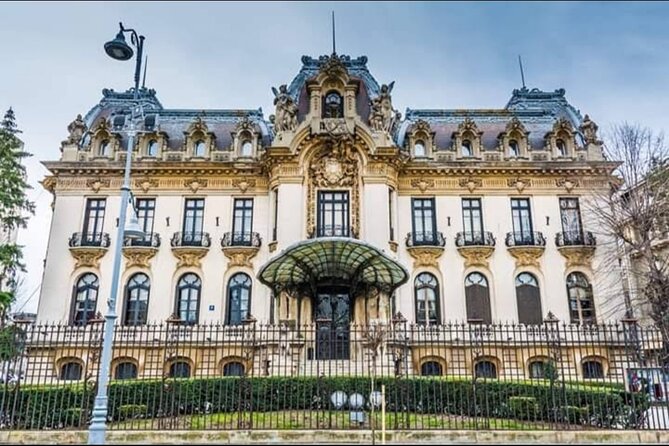 4h Bucharest Panoramic Tour by Car with stops - Triumph Arch to House of the Free Press: monuments with a story angle