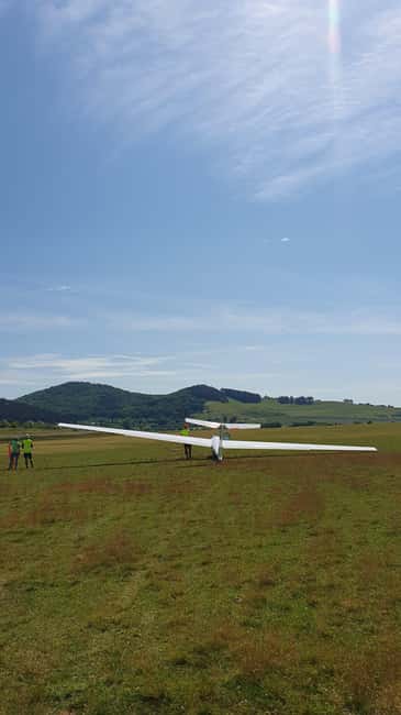 Brasov: Glider Flight Experience at Sanpetru Airfield - Before takeoff: safety training, parachute fitting, and comfort checks