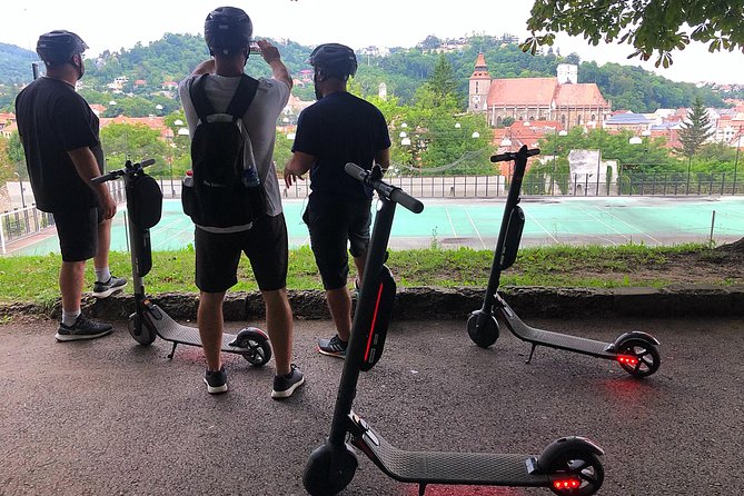 Brasov Old Town Guided Tour With Electric Scooters - Getting started at Corpul T and pickup within 10 minutes of the center