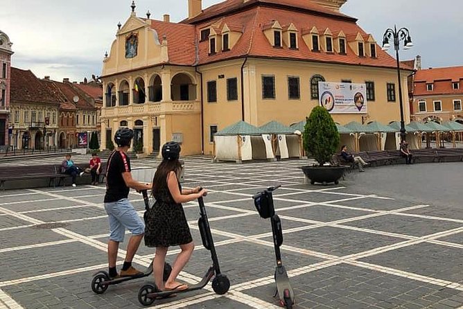 Brasov Old Town Guided Tour With Electric Scooters - The guide experience: Vlad’s style and the language mix