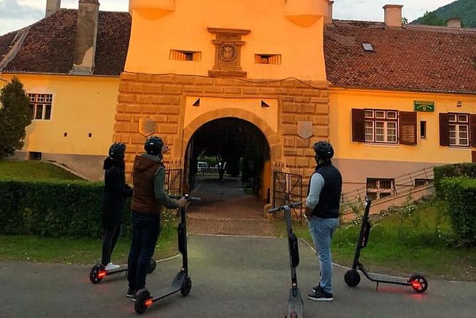Brasov Old Town Guided Tour With Electric Scooters - Gear and safety: helmet, wireless audio, and a guide who keeps it calm