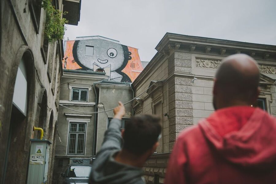Bucharest Alternative Walking Tour - Revolution Square by foot, plus the summer garden bookstore stop
