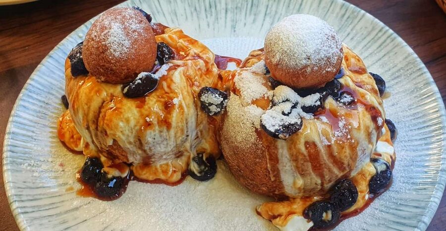 Bucharest: Sweet Delights History and Desserts Walking Tour - Old Town finale at City Grill Covaci for papanasi