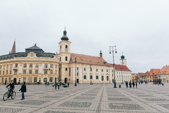 City Tour Sibiu in English - Council Tower (Turnul Sfatului) and the Orthodox Cathedral contrast