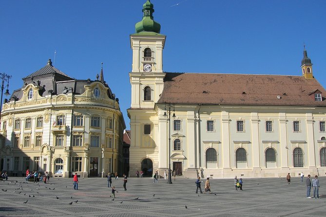 Saxon Heritage in Transylvania: Day Trip from Cluj-Napoca - Entering Sibiu, from Piata Mare to UNESCO streets and Council Tower views