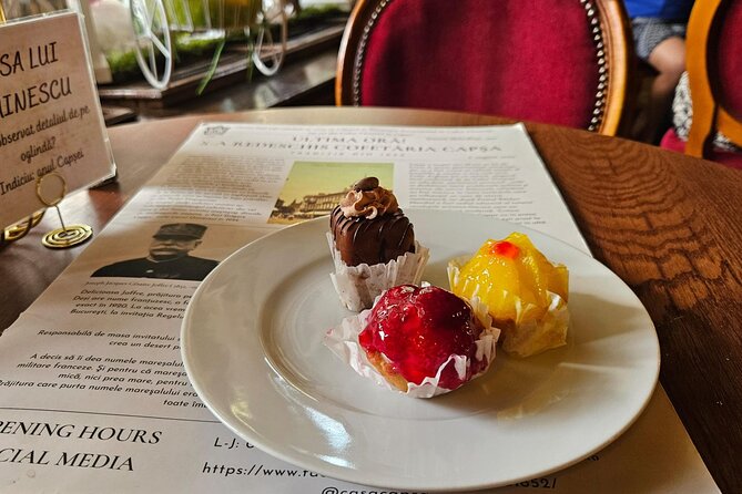 Sweet Delights History and Desserts Walking Tour in Bucharest - Stop 1: Romanian Athenaeum and an Eclair While You Hear the Monarchy Story