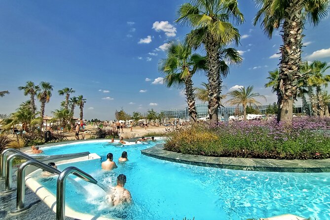 Therme Bucharest Tickets and Water Theme Park - PALM tropical pool world: plants, heated pools, and a sand beach